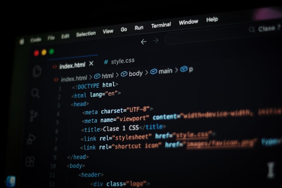 A close-up view of a computer screen displaying HTML code, with visible lines of markup language including tags for HTML, head, meta, title, and link elements. The code is highlighted with syntax colo